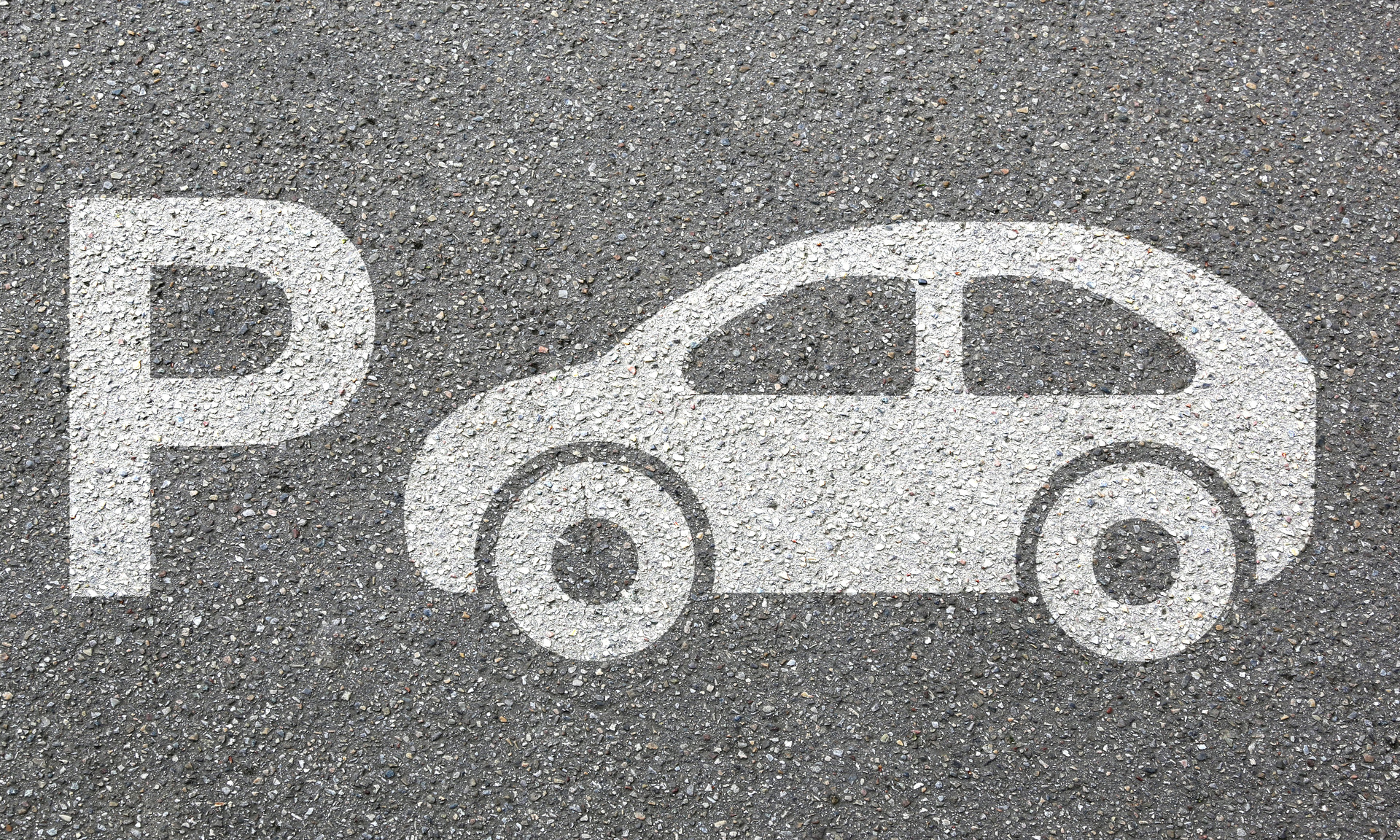 Icon von einem Auto mit einem großen P Symbol auf einem grauen Hintergrund 